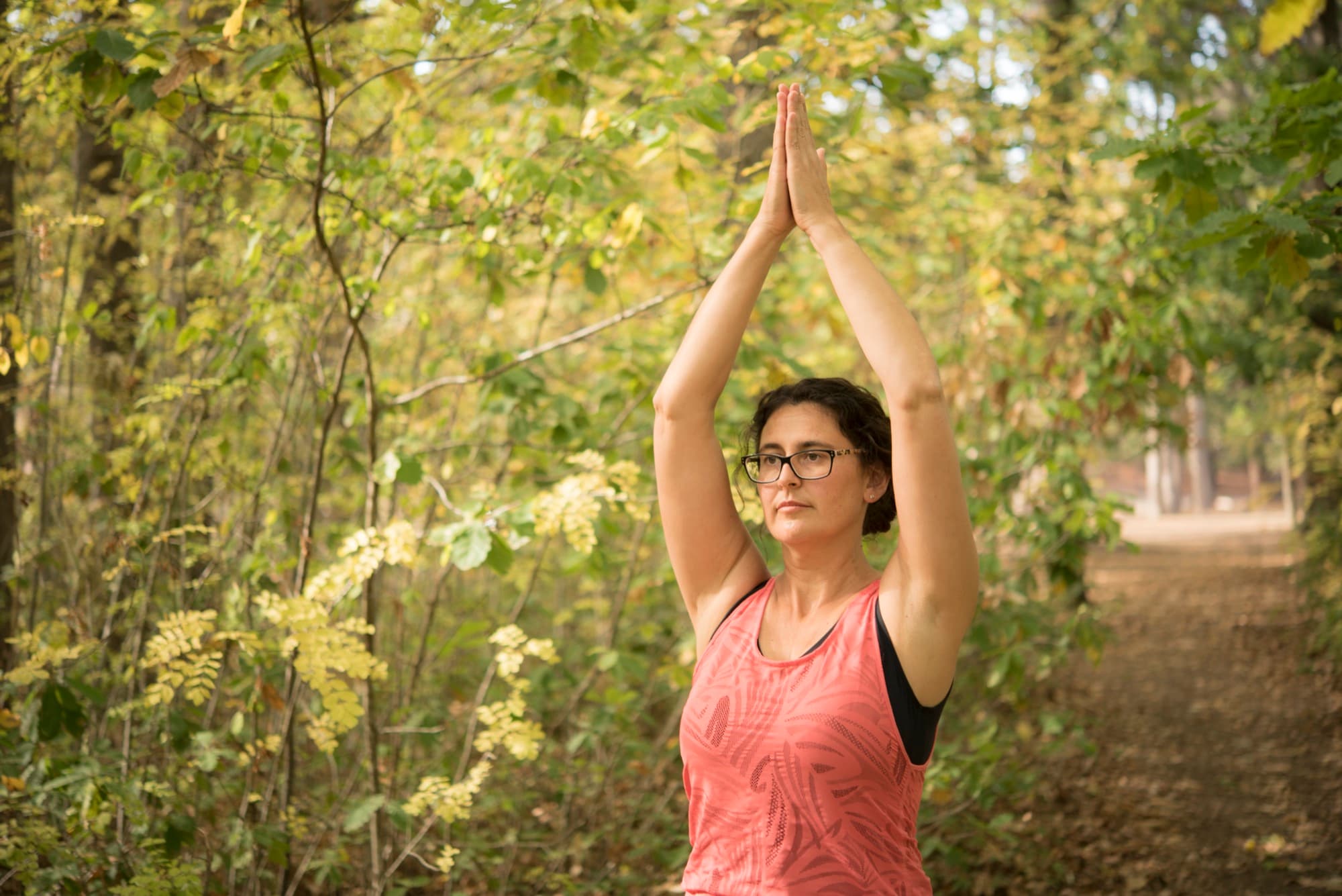 Jacqui Bohuslav-Andrews practising yoga in the forest