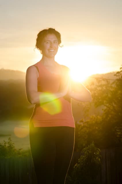 Jacqui practising yoga at sunrise in the hills of country Victoria